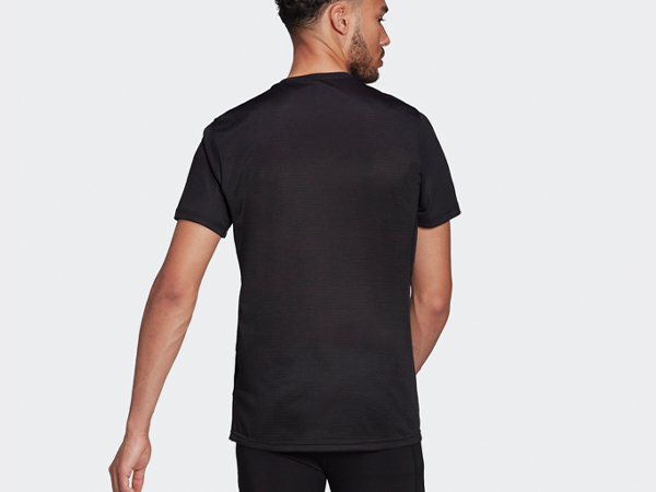 Male model showing the back of Adidas t-shirt