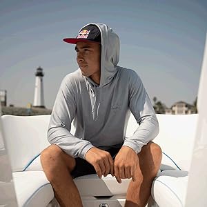 man sitting on a boat wearing o''neill 24/7 traveler hoodie